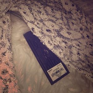 Jennifer Lopez gold and white dress